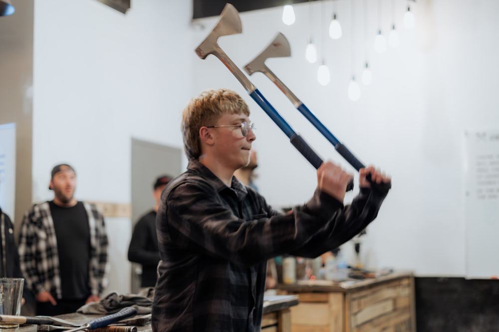 An agent winding up a double axe throw