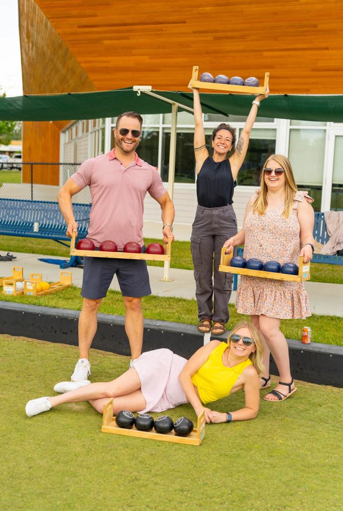 Agents hamming it up with lawn bowling racks